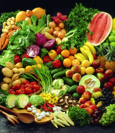 a large variety of vegetables on black background