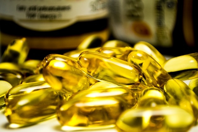 sprawled, golden, fish oil softgels  