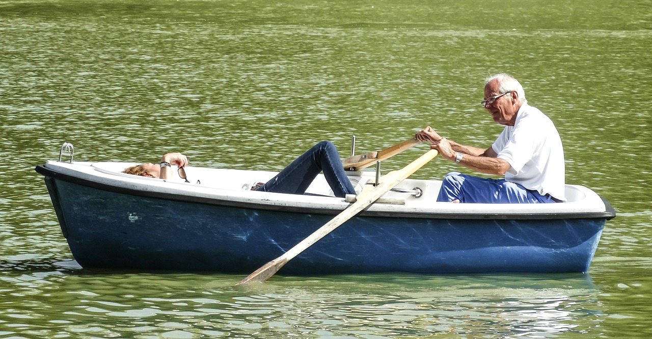 elderly couple on row boat
