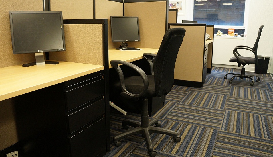 office cubicle with chair and desk