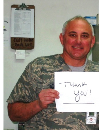 army man holding thank you sign