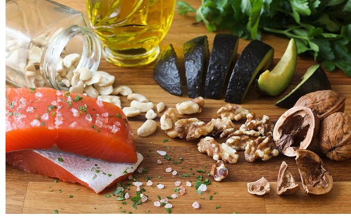 Omega 3 healthy fats food salmon avocado on butchers block